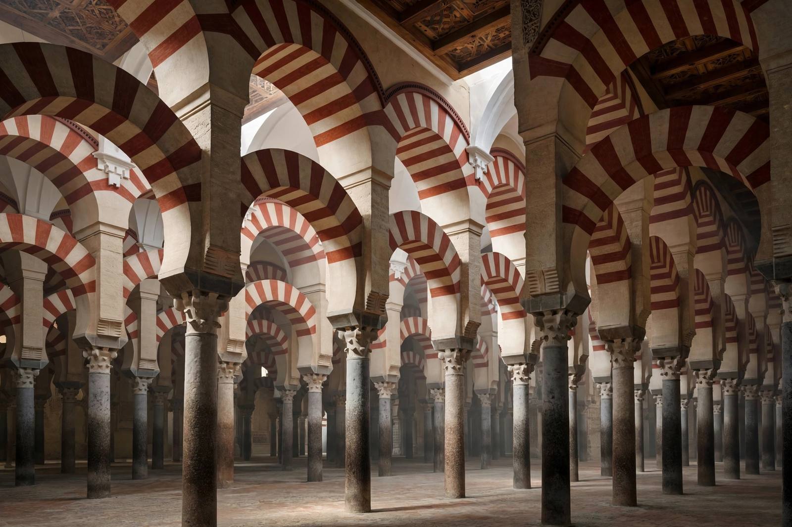 Interior of the Mezquita-Catedral in Cordoba with red-and-white arches