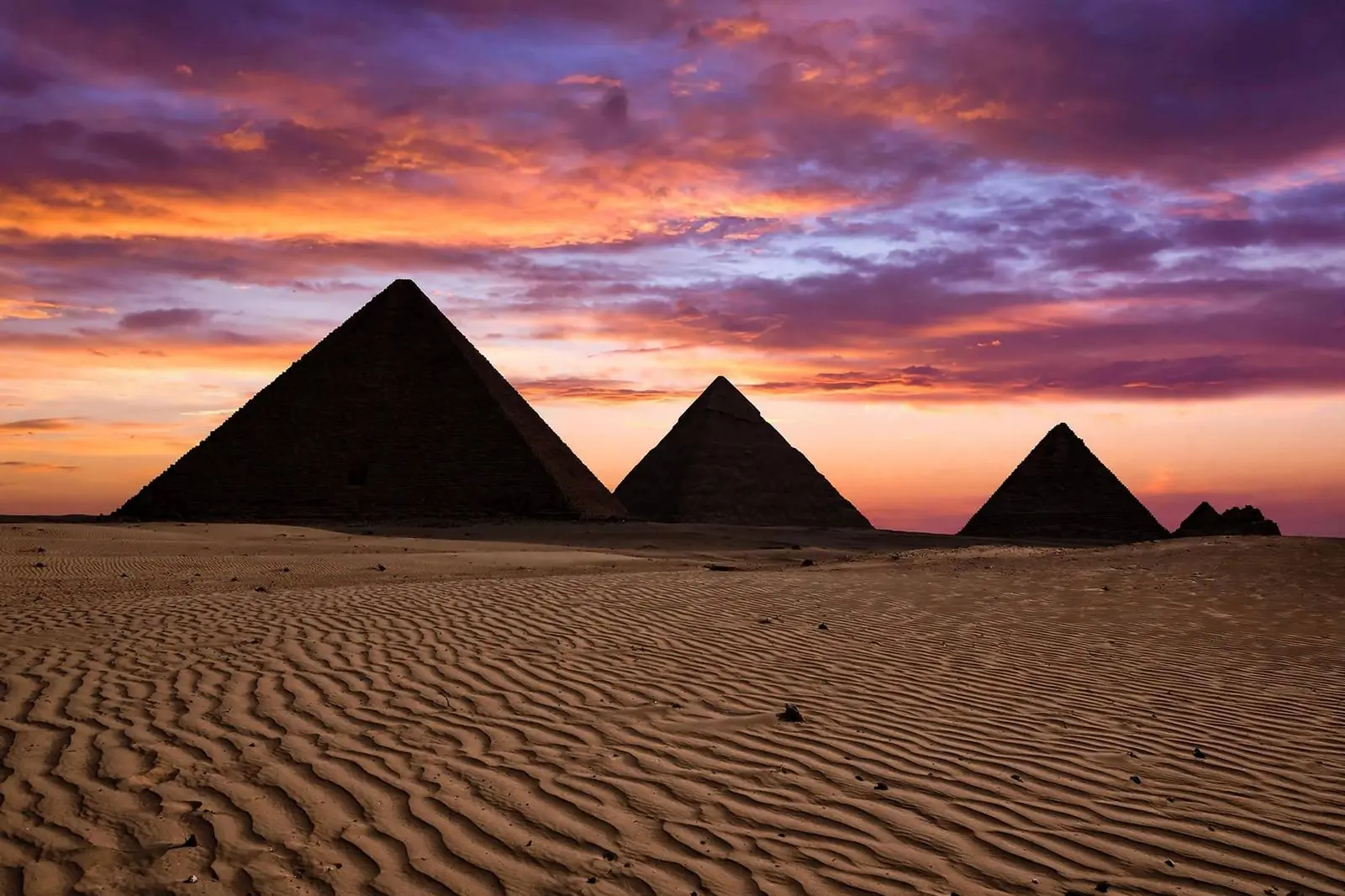 The Giza pyramids at sunset with warm desert light