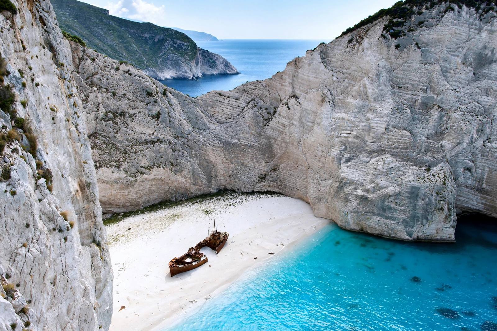 Navagio shipwreck beach Zakynthos with limestone cliffs